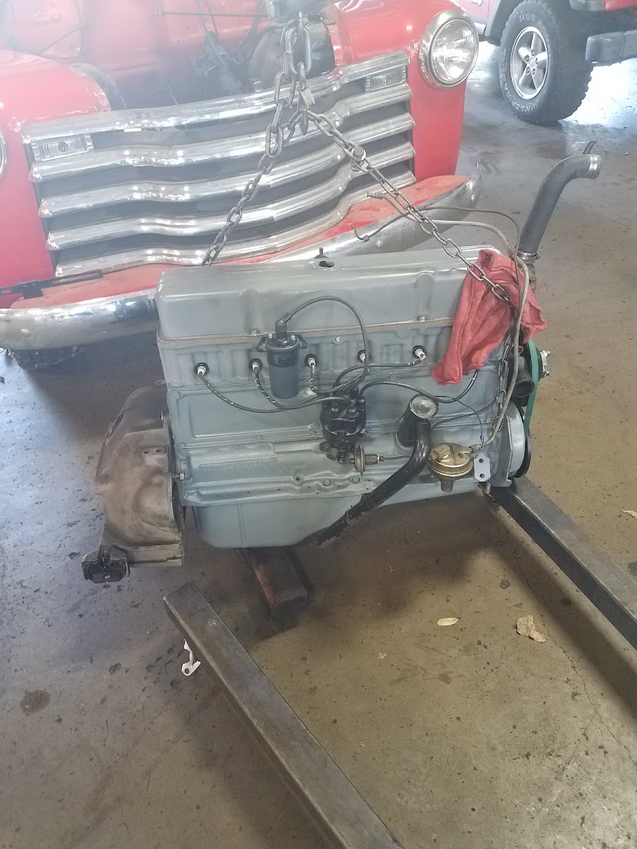 Restored classic engine on stand at Jack's Brake & Alignment Davenport
